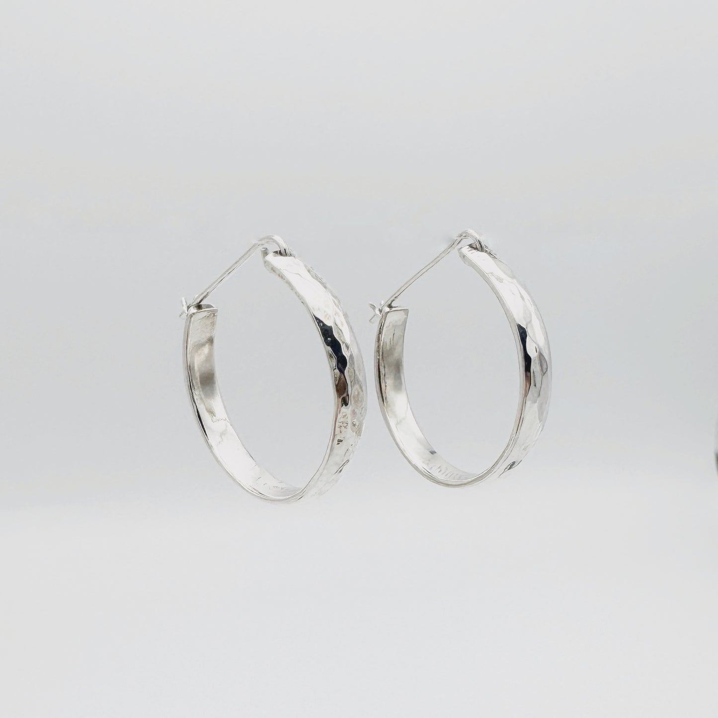 Sterling Silver fully closing hoops.
